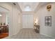 Elegant foyer featuring tile flooring, double doors, and a soaring ceiling with a transom window at 21616 67Th E Ave, Bradenton, FL 34211