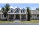 Charming home exterior featuring brick columns and a well-manicured front lawn at 21616 67Th E Ave, Bradenton, FL 34211