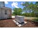Image of the Generac generator with a concrete base and mulch surroundings at 21616 67Th E Ave, Bradenton, FL 34211