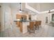 Open kitchen with a breakfast bar and lots of light from the glass doors at 21616 67Th E Ave, Bradenton, FL 34211