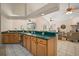 Kitchen with breakfast bar overlooking living room at 21616 67Th E Ave, Bradenton, FL 34211