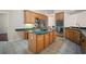 Kitchen featuring stainless appliances, large center island and tile floors at 21616 67Th E Ave, Bradenton, FL 34211