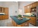 Spacious kitchen with tile floors, center island, and modern appliances at 21616 67Th E Ave, Bradenton, FL 34211