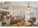 Open-concept living area with views to the pool from the doors at 21616 67Th E Ave, Bradenton, FL 34211