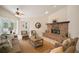 Bright living room with fireplace, large sectional sofa, and decor at 21616 67Th E Ave, Bradenton, FL 34211