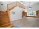 A large living room boasts natural light, wood flooring and built-in bookshelves at 21616 67Th E Ave, Bradenton, FL 34211