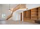 This living room shows an open floor plan and staircase to the second floor at 21616 67Th E Ave, Bradenton, FL 34211