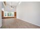 Bright living room featuring hardwood floors, large windows, and built in shelves at 21616 67Th E Ave, Bradenton, FL 34211