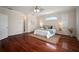 Bright main bedroom offering hardwood floors, a ceiling fan, and a tranquil atmosphere at 21616 67Th E Ave, Bradenton, FL 34211