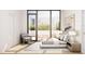 Bright bedroom featuring a sliding glass door to a balcony and stylish, minimalist decor at 2170 Robinhood St # A1-302, Sarasota, FL 34231