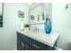 Bathroom with custom vanity and decorative seaside accents at 221 Grant Dr, Sarasota, FL 34236