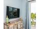 Bedroom featuring a TV, dresser, and access to a balcony at 221 Grant Dr, Sarasota, FL 34236
