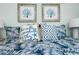 Comfortable bedroom features beach-themed decor and linens at 221 Grant Dr, Sarasota, FL 34236