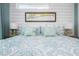 Comfortable bedroom with white shiplap, decorative map, and matching lamps at 221 Grant Dr, Sarasota, FL 34236