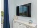 Bedroom showcases a TV and balcony access with a coastal view at 221 Grant Dr, Sarasota, FL 34236