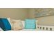 Cozy bedroom with beach themed throw pillows and decor at 221 Grant Dr, Sarasota, FL 34236