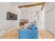 Comfortable living room showcasing a wet bar, coastal decor, and light wood floors at 221 Grant Dr, Sarasota, FL 34236