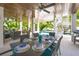 Charming outdoor dining area with ample seating, ideal for hosting gatherings and enjoying meals at 221 Grant Dr, Sarasota, FL 34236
