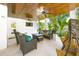 Inviting covered patio with comfortable seating, perfect for relaxation and enjoying the outdoors at 221 Grant Dr, Sarasota, FL 34236