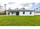 This backyard boasts a well-maintained lawn and inviting outdoor space perfect for leisure and social gatherings at 2231 Hagoplan Ln, North Port, FL 34288