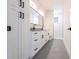 Elegant bathroom with a double vanity, modern fixtures, and ample cabinet space at 2231 Hagoplan Ln, North Port, FL 34288