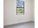 Bedroom with tile flooring and a window view at 2231 Hagoplan Ln, North Port, FL 34288