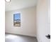 Bright bedroom with gray tile, a large window, and clean, modern design at 2231 Hagoplan Ln, North Port, FL 34288