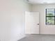 Bedroom with a window and a closet door at 2231 Hagoplan Ln, North Port, FL 34288
