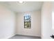 Bedroom with tile flooring and a window view at 2231 Hagoplan Ln, North Port, FL 34288