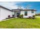Well-maintained home featuring fresh landscaping, stone pathway and neutral colors at 2231 Hagoplan Ln, North Port, FL 34288