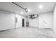 A spacious, well-lit garage with ample room for parking and storage, complete with utility connections at 2231 Hagoplan Ln, North Port, FL 34288