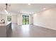 Spacious kitchen with gray tile floor, stainless appliances, and stone countertops at 2231 Hagoplan Ln, North Port, FL 34288