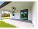 A covered patio with a ceiling fan and view of the backyard at 2231 Hagoplan Ln, North Port, FL 34288