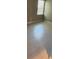 Cozy bedroom with tile flooring, a large window, and neutral walls creating a versatile living space at 24835 Buckingham Way, Port Charlotte, FL 33980