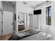 Bright bedroom featuring sliding closet doors, a plush bed, and serene views at 25305 83Rd E Ave, Myakka City, FL 34251