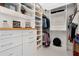 Well-organized walk-in closet with custom shelving, drawers, and ample storage for clothing at 25305 83Rd E Ave, Myakka City, FL 34251