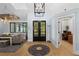 Inviting entryway with hardwood floors, decorative rug, and view of outdoor landscape at 25305 83Rd E Ave, Myakka City, FL 34251
