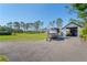Large lot with a boat and covered storage, showcasing outdoor amenities at 25305 83Rd E Ave, Myakka City, FL 34251