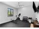 Home gym equipped with exercise bike, weights, and a wall-mounted TV for entertainment at 25305 83Rd E Ave, Myakka City, FL 34251