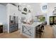 Spacious kitchen with large island, stainless steel appliances, and stylish barstool seating at 25305 83Rd E Ave, Myakka City, FL 34251