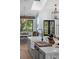 Bright and airy kitchen with an island and views of the dining and outdoor areas at 25305 83Rd E Ave, Myakka City, FL 34251