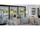 Cozy living room with a view of the outdoor pool area at 25305 83Rd E Ave, Myakka City, FL 34251