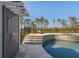 Beautiful pool area featuring an outdoor shower, tanning ledge, spa, and meticulous tile work at 25305 83Rd E Ave, Myakka City, FL 34251