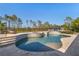 Inviting backyard pool and spa area with tanning chairs and mature trees at 25305 83Rd E Ave, Myakka City, FL 34251