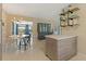 Open-concept dining area with stylish lighting and a view into the living room at 2708 Fort Worth St, Sarasota, FL 34231