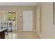 Entryway showcasing the terrazzo floors and bright entry door at 2708 Fort Worth St, Sarasota, FL 34231