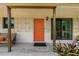 Charming front porch featuring a bright orange door, modern exterior, and stylish decor at 2708 Fort Worth St, Sarasota, FL 34231