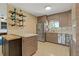 Well-lit kitchen featuring modern cabinetry, stainless steel appliances, and open shelving at 2708 Fort Worth St, Sarasota, FL 34231