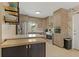 Modern kitchen featuring stainless steel appliances, stylish wood cabinets, and quartz countertops at 2708 Fort Worth St, Sarasota, FL 34231