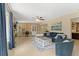 Spacious living room featuring sleek furniture, a ceiling fan, and views of the backyard at 2708 Fort Worth St, Sarasota, FL 34231